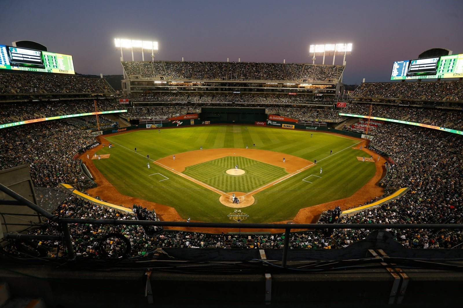 A baseball field and stadium full of fans